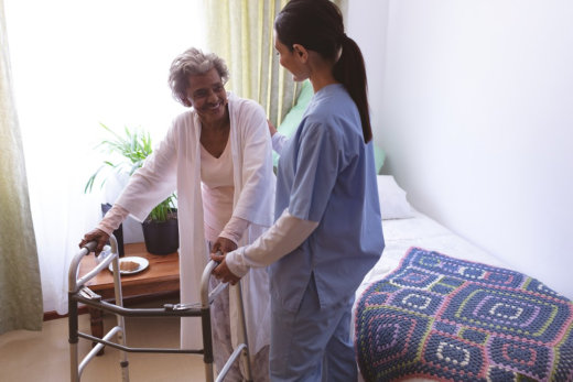 Old woman holding stretcher and nurse supporting senior